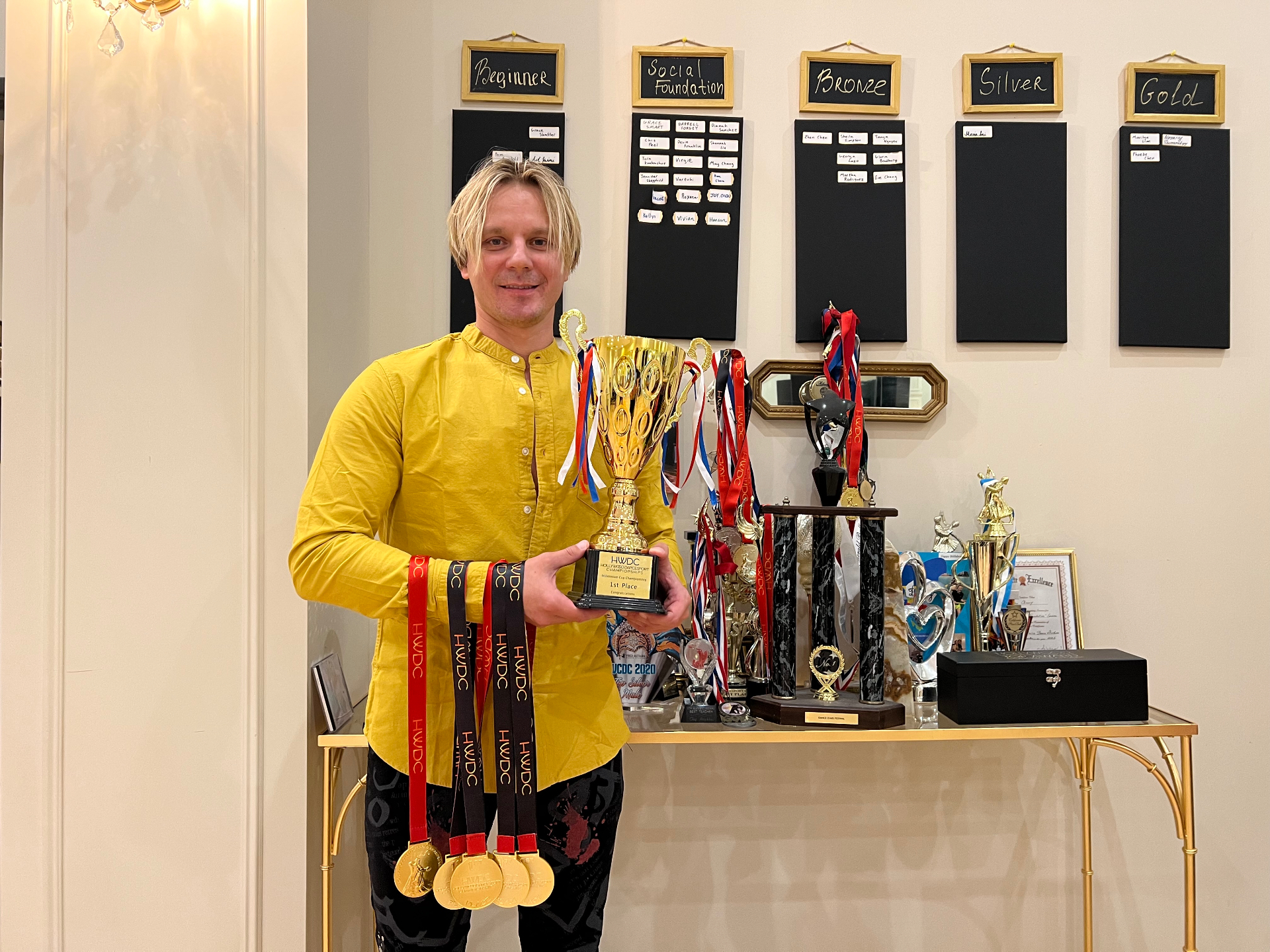 Oleg with his dance trophies and medals